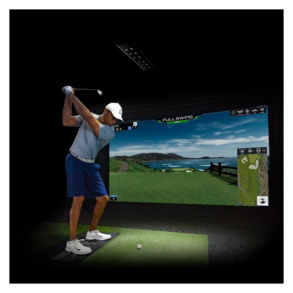 guy playing on full swing golf simulator
