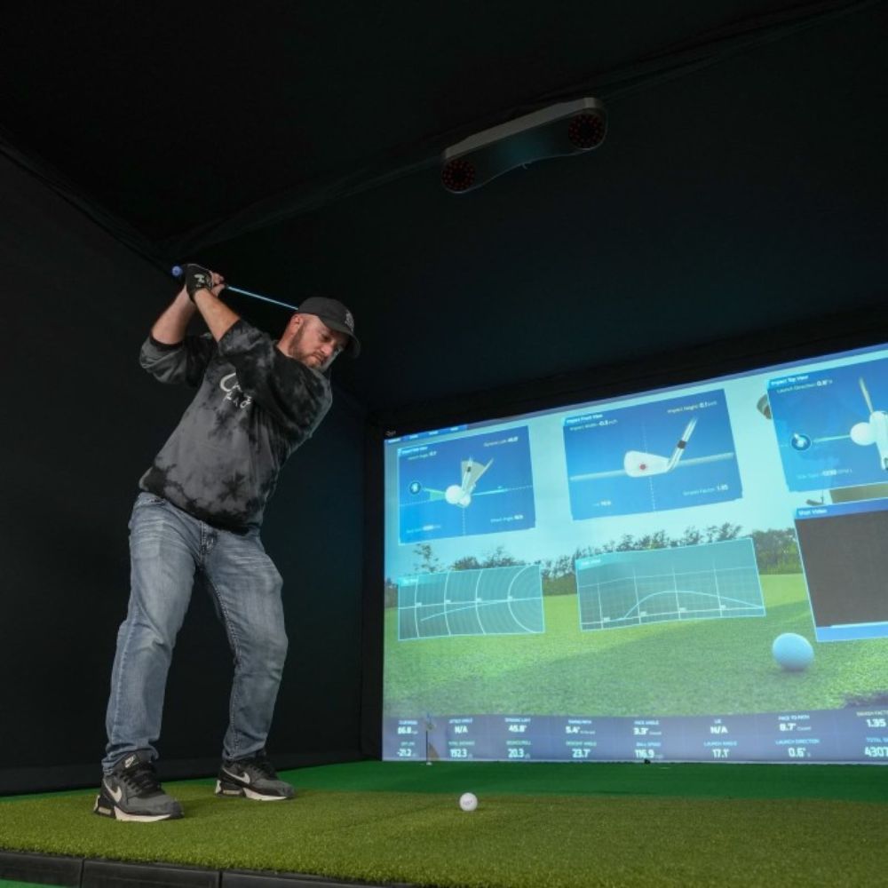 guy_playing_on_a_ProTee_VX_golf_simulator_setup_with_ProTee_software