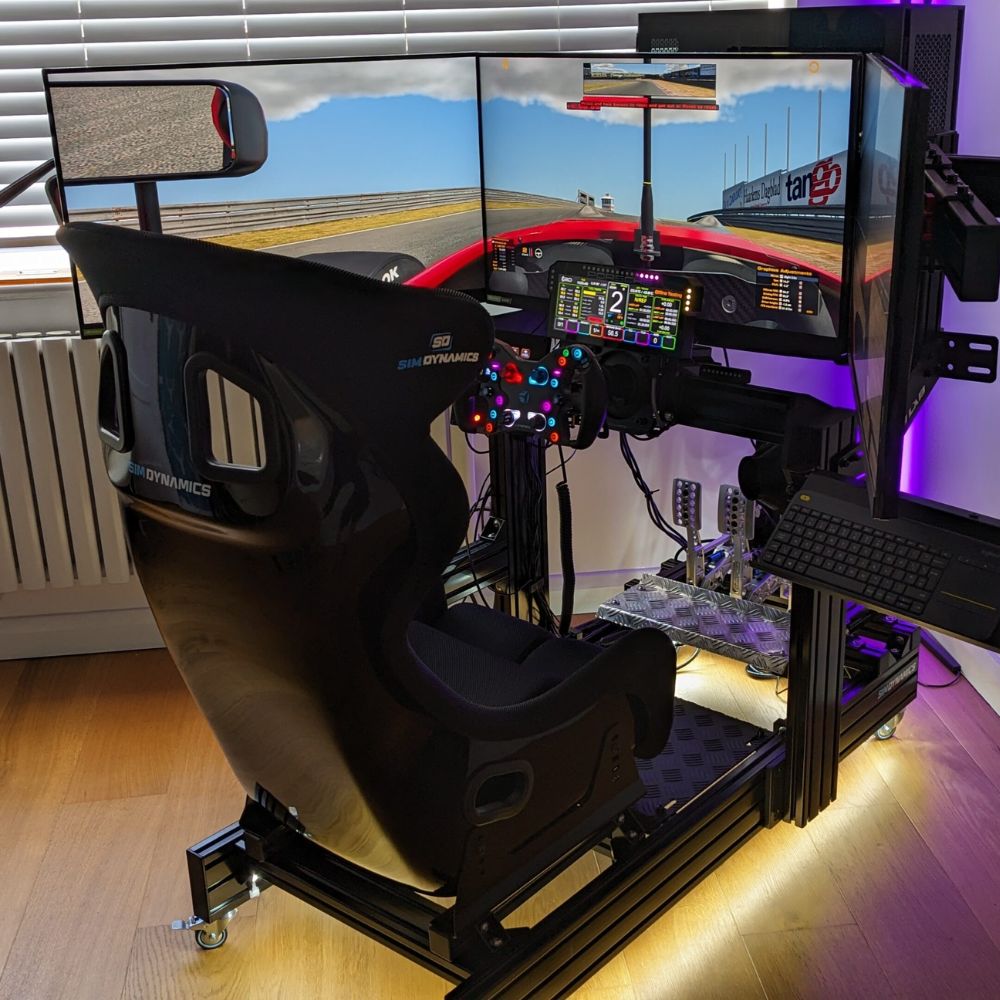 racing simulator with triple monitors and a monitor stand